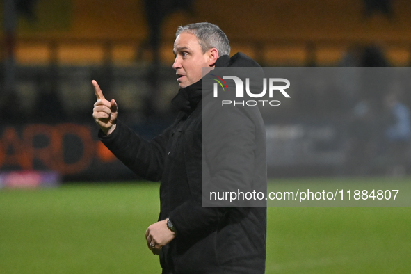 Manager Michael Duff of Huddersfield gestures to fans after the final whistle during the Sky Bet League 1 match between Cambridge United and...