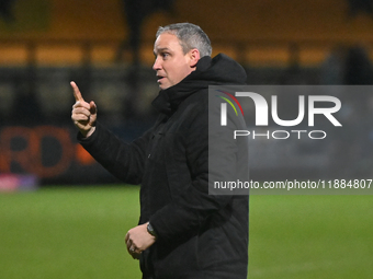 Manager Michael Duff of Huddersfield gestures to fans after the final whistle during the Sky Bet League 1 match between Cambridge United and...