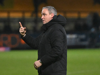 Manager Michael Duff of Huddersfield gestures to fans after the final whistle during the Sky Bet League 1 match between Cambridge United and...