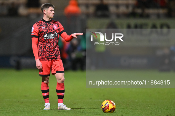 Ben Wiles (8 Huddersfield) prepares to take a free kick during the Sky Bet League 1 match between Cambridge United and Huddersfield Town at...