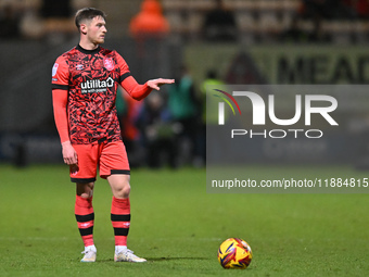 Ben Wiles (8 Huddersfield) prepares to take a free kick during the Sky Bet League 1 match between Cambridge United and Huddersfield Town at...