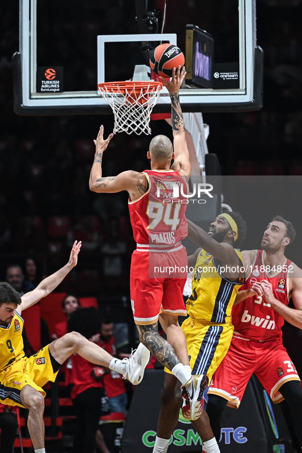 Evan Fournier of Olympiacos Piraeus competes with Trevion Williams of Alba Berlin during the Euroleague, Round 17 match between Olympiacos P...