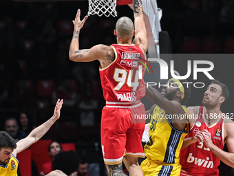 Evan Fournier of Olympiacos Piraeus competes with Trevion Williams of Alba Berlin during the Euroleague, Round 17 match between Olympiacos P...