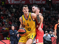 Yanni Wetzell of Alba Berlin competes with Luca Vildoza of Olympiacos Piraeus during the Euroleague, Round 17 match between Olympiacos Pirae...