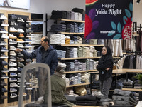 A young Iranian couple shops during Yalda Night celebrations at the Iran Mall shopping mall in northwestern Tehran, Iran, on December 20, 20...