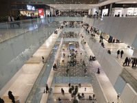 Iranian shoppers walk at the Iran Mall shopping mall in northwestern Tehran, Iran, on December 20, 2024, during Yalda Night celebrations. Ya...