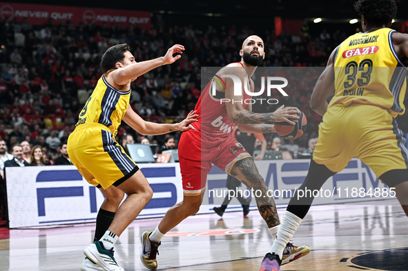 Evan Fournier of Olympiacos Piraeus competes with Matteo Spagnolo of Alba Berlin during the Euroleague, Round 17 match between Olympiacos Pi...