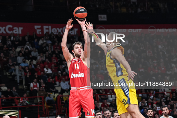 Sasha Vezenkov of Olympiacos Piraeus competes with Tim Schneider of Alba Berlin during the Euroleague, Round 17 match between Olympiacos Pir...