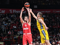 Sasha Vezenkov of Olympiacos Piraeus competes with Tim Schneider of Alba Berlin during the Euroleague, Round 17 match between Olympiacos Pir...