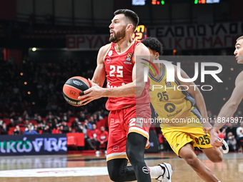 Alec Peters of Olympiacos Piraeus competes with Elias Rapieque of Alba Berlin during the Euroleague, Round 17 match between Olympiacos Pirae...