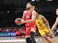 Alec Peters of Olympiacos Piraeus competes with Elias Rapieque of Alba Berlin during the Euroleague, Round 17 match between Olympiacos Pirae...