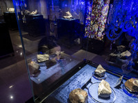 A young Iranian girl observes meteorites at the meteorite museum while visiting the Iran Mall shopping mall in northwestern Tehran, Iran, on...