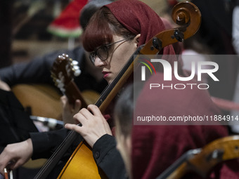 A young Iranian female musician performs during Yalda Night celebrations at the Iran Mall shopping mall in northwestern Tehran, Iran, on Dec...