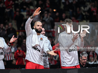 Bench players 94 Evan Fournier and 14 Sasha Vezenkov of Olympiacos Piraeus during the Euroleague, Round 17 match between Olympiacos Piraeus...