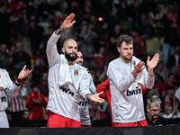 Bench players 94 Evan Fournier and 14 Sasha Vezenkov of Olympiacos Piraeus during the Euroleague, Round 17 match between Olympiacos Piraeus...