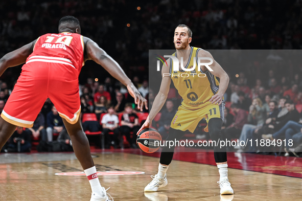 Matt Thomas of Alba Berlin competes with Moustapha Fall of Olympiacos Piraeus during the Euroleague, Round 17 match between Olympiacos Pirae...