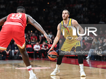 Matt Thomas of Alba Berlin competes with Moustapha Fall of Olympiacos Piraeus during the Euroleague, Round 17 match between Olympiacos Pirae...