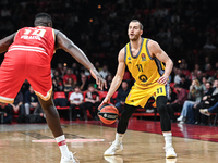 Matt Thomas of Alba Berlin competes with Moustapha Fall of Olympiacos Piraeus during the Euroleague, Round 17 match between Olympiacos Pirae...