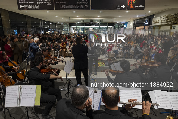 Iranian musicians perform during Yalda Night celebrations at the Iran Mall shopping mall in northwestern Tehran, Iran, on December 20, 2024....