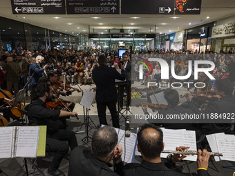 Iranian musicians perform during Yalda Night celebrations at the Iran Mall shopping mall in northwestern Tehran, Iran, on December 20, 2024....