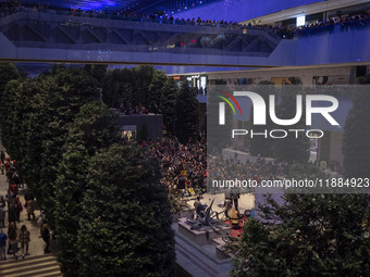 Iranian families participate in Yalda Night celebrations at the Iran Mall shopping mall in northwestern Tehran, Iran, on December 20, 2024....