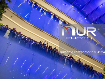 Iranian families participate in Yalda Night celebrations at the Iran Mall shopping mall in northwestern Tehran, Iran, on December 20, 2024....