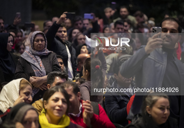 A young Iranian girl dances during Yalda Night celebrations at the Iran Mall shopping mall in northwestern Tehran, Iran, on December 20, 202...