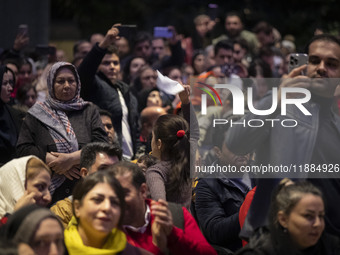 A young Iranian girl dances during Yalda Night celebrations at the Iran Mall shopping mall in northwestern Tehran, Iran, on December 20, 202...