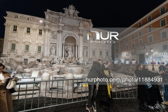 Restoration work on the Trevi Fountain is completed. Workers clean the lower part and fill the joints over two months, and they remove the s...