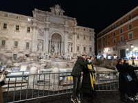 Restoration work on the Trevi Fountain is completed. Workers clean the lower part and fill the joints over two months, and they remove the s...