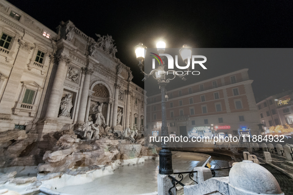 Restoration work on the Trevi Fountain is completed. Workers clean the lower part and fill the joints over two months, and they remove the s...