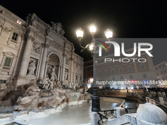 Restoration work on the Trevi Fountain is completed. Workers clean the lower part and fill the joints over two months, and they remove the s...