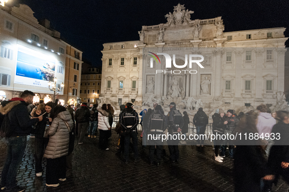 Restoration work on the Trevi Fountain is completed. Workers clean the lower part and fill the joints over two months, and they remove the s...