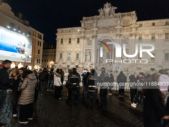 Restoration work on the Trevi Fountain is completed. Workers clean the lower part and fill the joints over two months, and they remove the s...