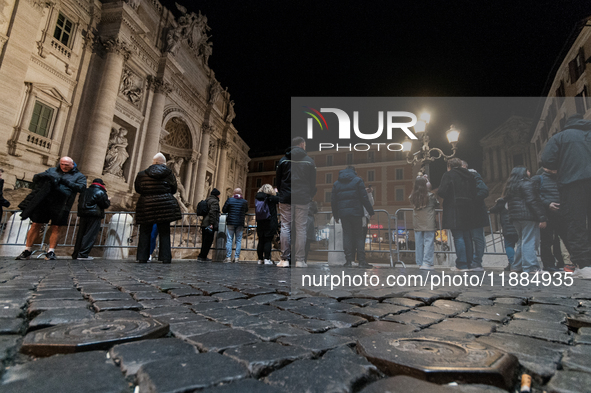 Restoration work on the Trevi Fountain is completed. Workers clean the lower part and fill the joints over two months, and they remove the s...