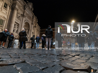 Restoration work on the Trevi Fountain is completed. Workers clean the lower part and fill the joints over two months, and they remove the s...