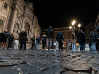 Restoration work on the Trevi Fountain is completed. Workers clean the lower part and fill the joints over two months, and they remove the s...