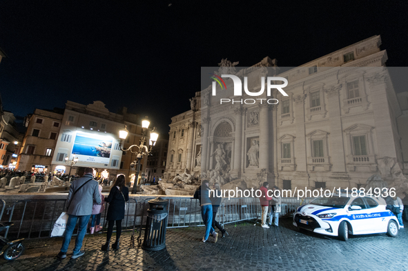 Restoration work on the Trevi Fountain is completed. Workers clean the lower part and fill the joints over two months, and they remove the s...