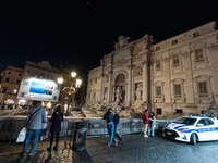 Restoration work on the Trevi Fountain is completed. Workers clean the lower part and fill the joints over two months, and they remove the s...