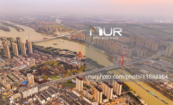 Cargo ships loaded with agricultural supplies, building materials, coal, and other goods sail on the Beijing-Hangzhou Grand Canal in Suqian,...