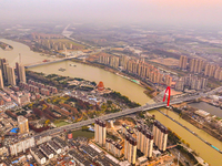 Cargo ships loaded with agricultural supplies, building materials, coal, and other goods sail on the Beijing-Hangzhou Grand Canal in Suqian,...