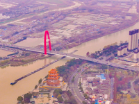 Cargo ships loaded with agricultural supplies, building materials, coal, and other goods sail on the Beijing-Hangzhou Grand Canal in Suqian,...