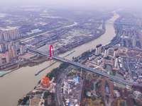 Cargo ships loaded with agricultural supplies, building materials, coal, and other goods sail on the Beijing-Hangzhou Grand Canal in Suqian,...