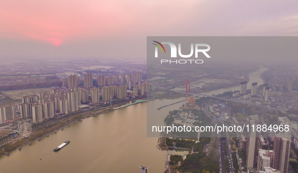 Cargo ships loaded with agricultural supplies, building materials, coal, and other goods sail on the Beijing-Hangzhou Grand Canal in Suqian,...