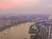 Cargo ships loaded with agricultural supplies, building materials, coal, and other goods sail on the Beijing-Hangzhou Grand Canal in Suqian,...