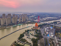 Cargo ships loaded with agricultural supplies, building materials, coal, and other goods sail on the Beijing-Hangzhou Grand Canal in Suqian,...