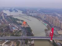 Cargo ships loaded with agricultural supplies, building materials, coal, and other goods sail on the Beijing-Hangzhou Grand Canal in Suqian,...