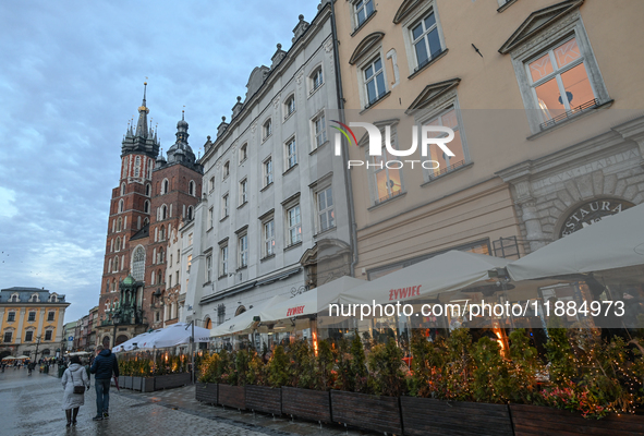 KRAKOW, POLAND - DECEMBER 20:   
A view of heated restaurant gardens, adorned with festive Christmas lights and decorations, bring warmth to...