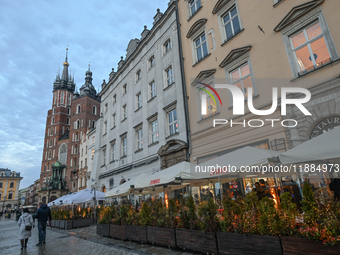 KRAKOW, POLAND - DECEMBER 20:   
A view of heated restaurant gardens, adorned with festive Christmas lights and decorations, bring warmth to...