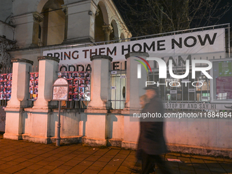 KRAKOW, POLAND - DECEMBER 20:   
A giant 'Bring Them Home Now' message, accompanied by images of people kidnapped by Hamas, is displayed at...